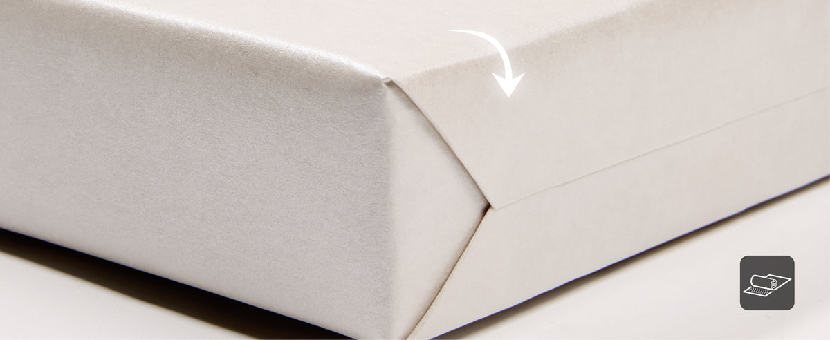 Pearly white wrapping paper rolls with a diagram comparing the 17-inch width to a 30-inch bat