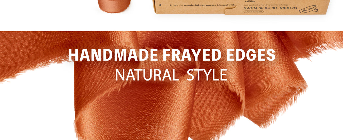 Close-up of terracotta satin ribbon showing a smooth sheen and softly finished ribbon edge