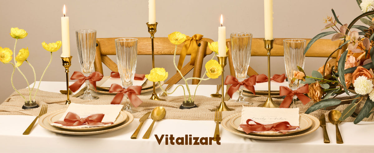 Terracotta satin ribbon woven through an elegant table setting with flowers and candles