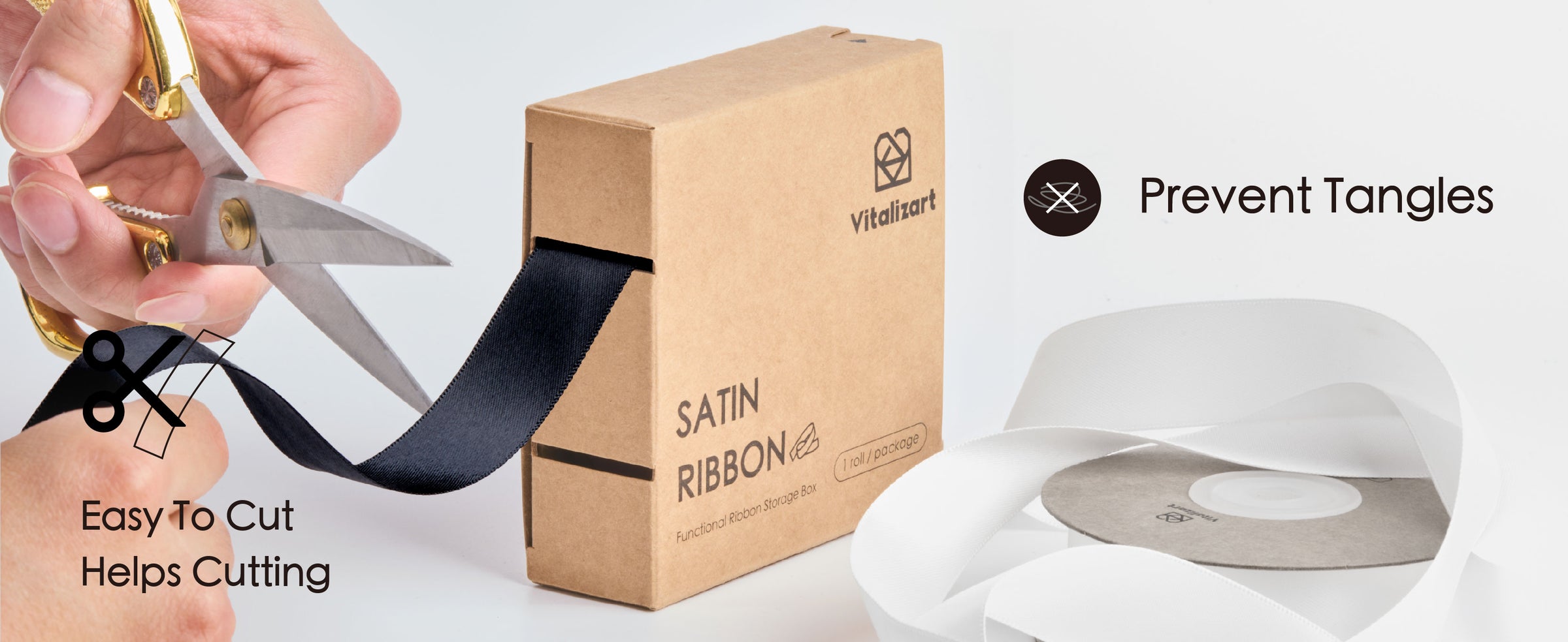 Black satin ribbon feeds from a cardboard dispenser while a hand cuts it with scissors.