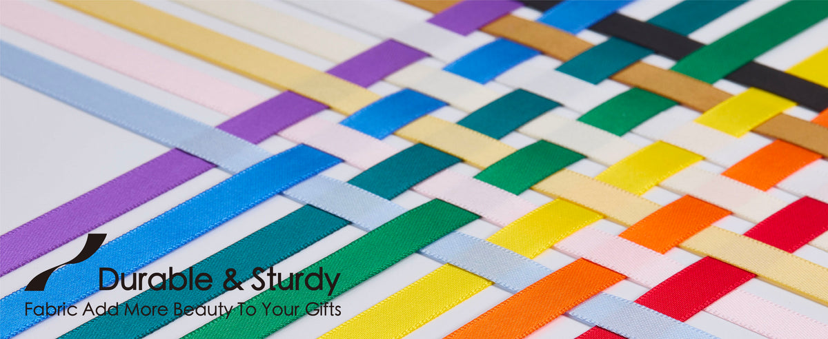Interwoven strands from the rainbow double-faced satin ribbon set displayed in coordinated colors