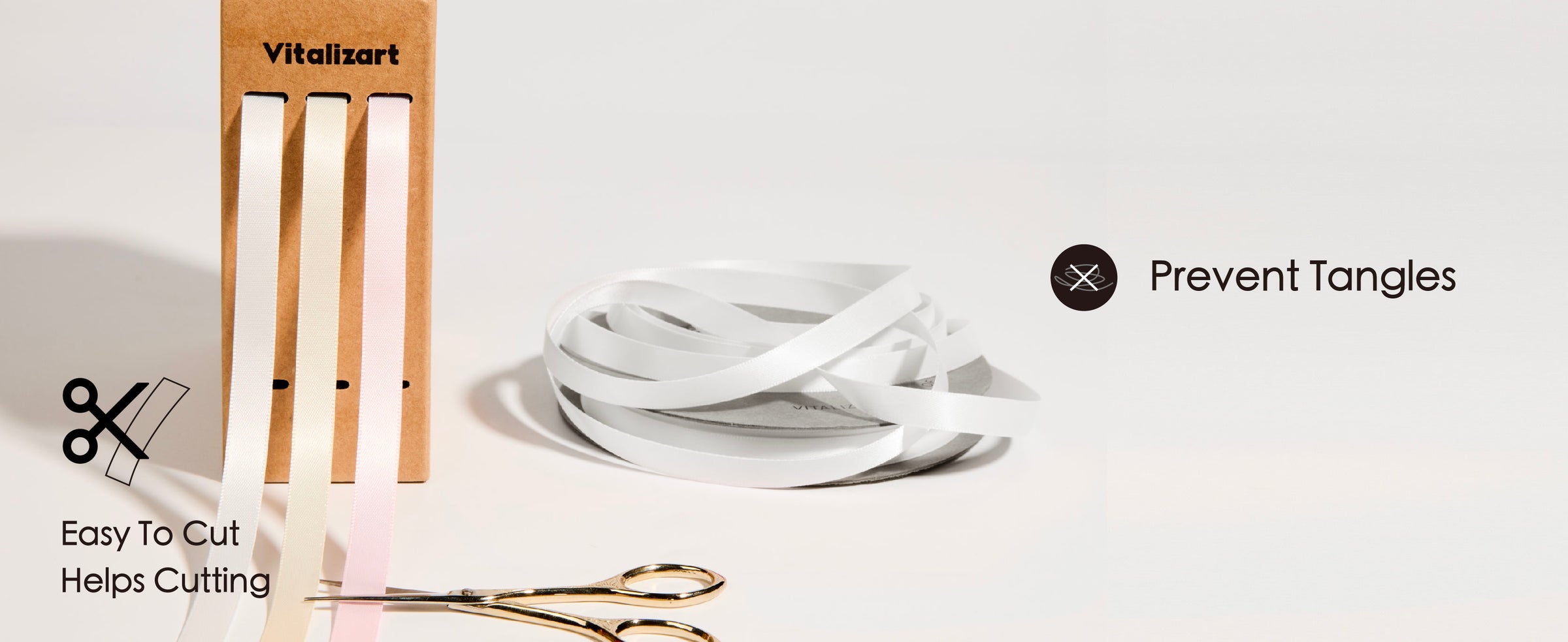 Scissors cutting the pink and white double-faced satin ribbon set to show a clean ribbon edge for crafting