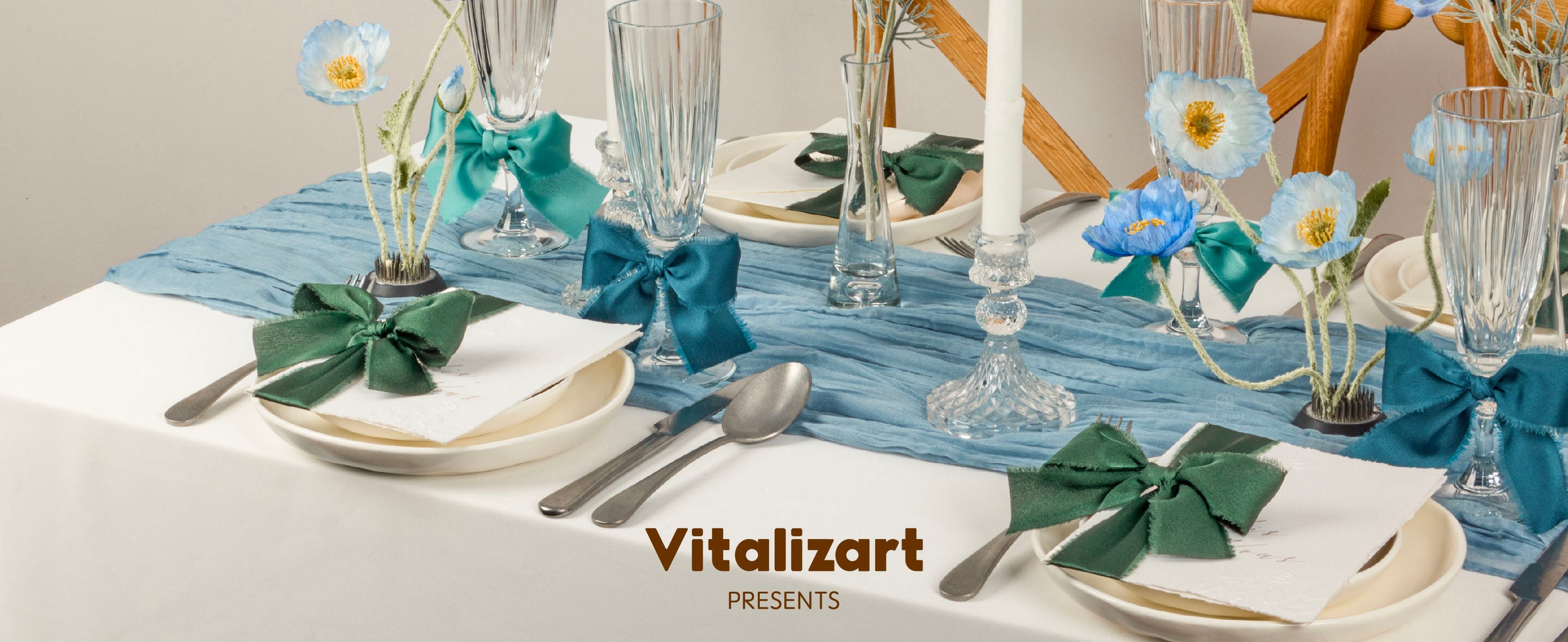 Teal, blue, and green satin ribbon bows accent a blue-and-white floral table setting