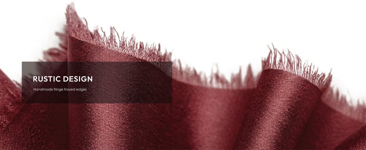 Burgundy satin ribbon close-up highlighting its handmade-style irregular frayed edge