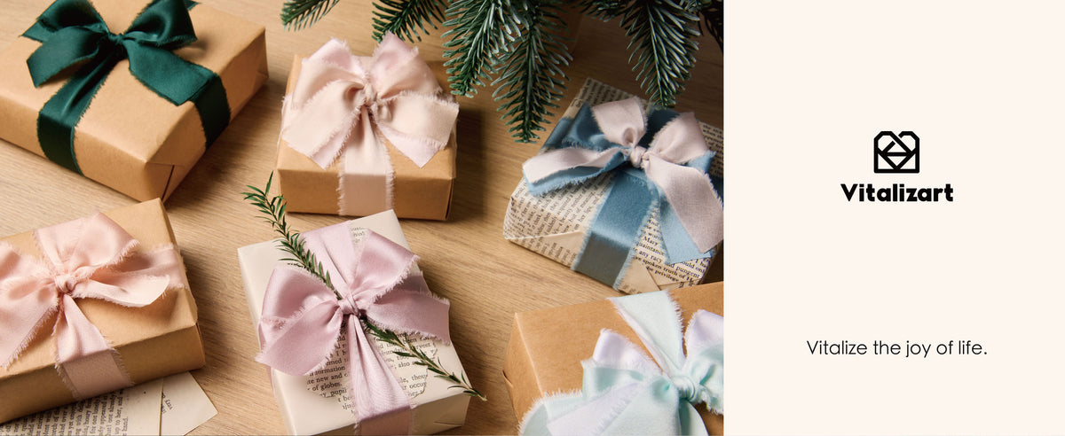 Gift boxes tied with frayed satin ribbon bows in dark green, pink, blue, and mint on a wooden table.