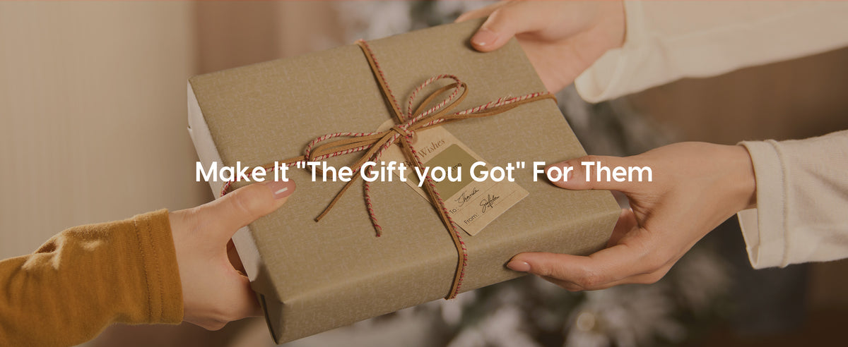 Hands exchanging a beige textured-paper gift tied with red-white cord, brown ribbon and a kraft tag