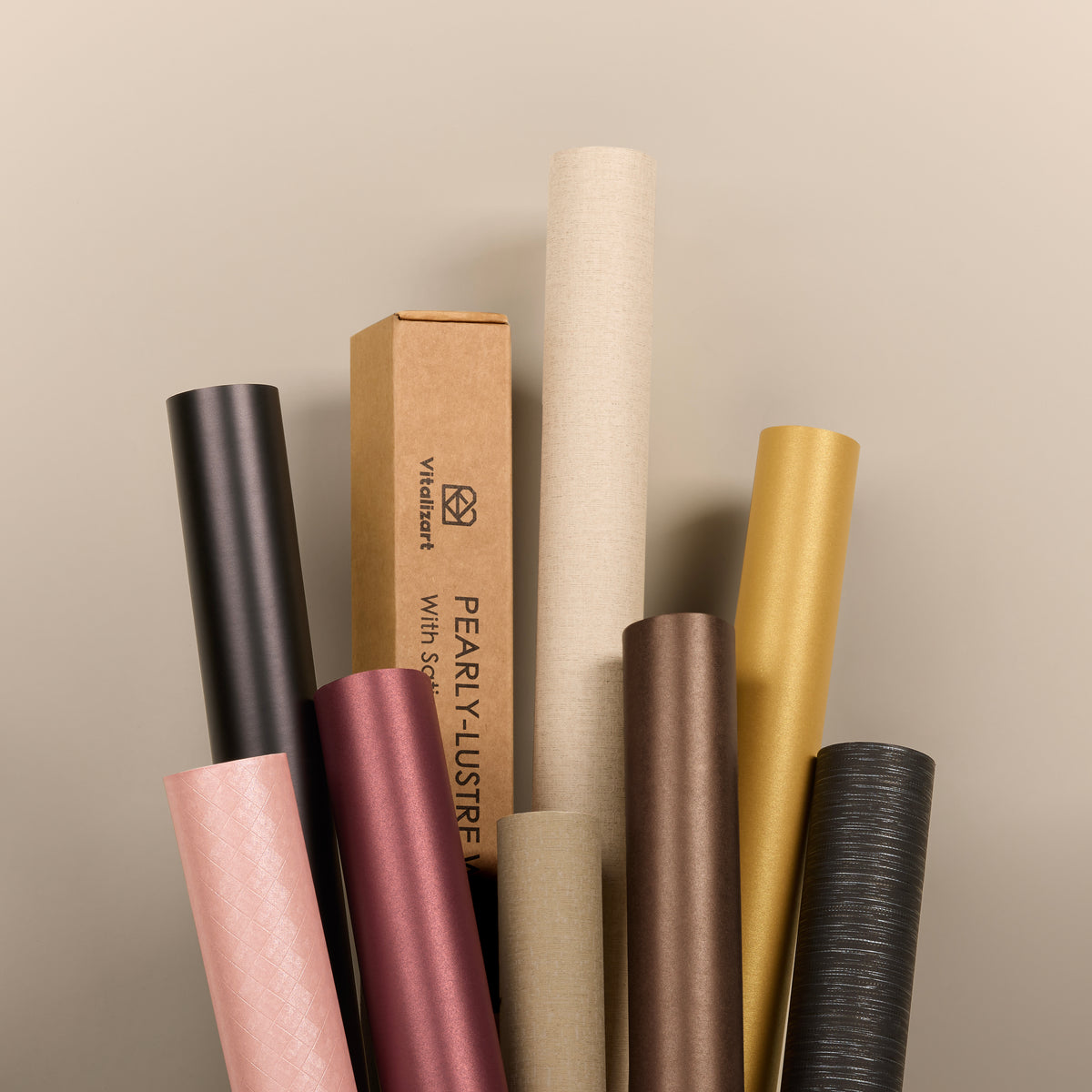 Pearlescent wrapping paper rolls in black, gold, rose and neutral colors