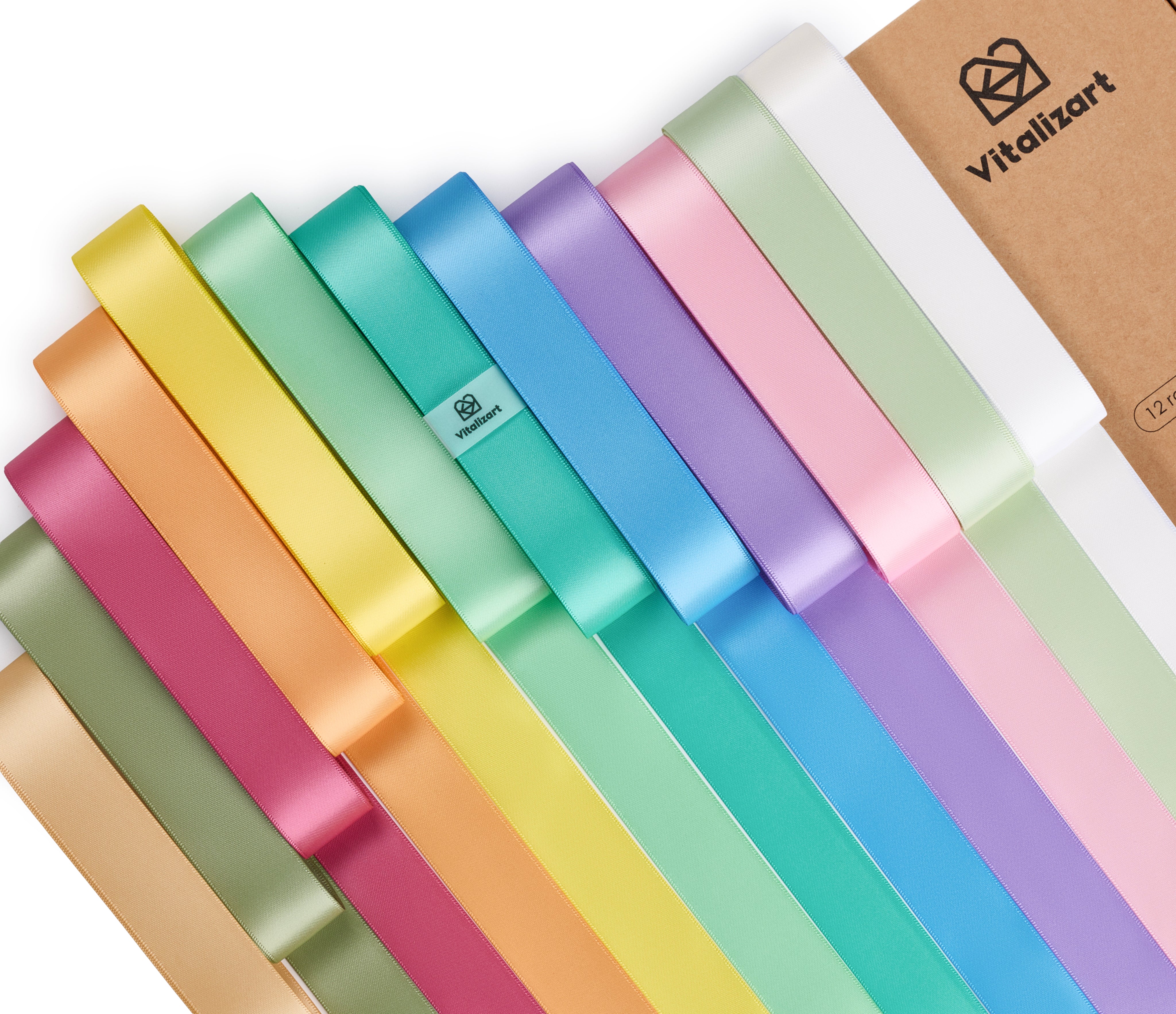 Vitalizart satin ribbons in rainbow colors beside branded packaging