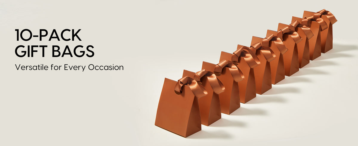 Ten copper-brown paper gift bags with matching satin ribbon handles arranged in a diagonal row