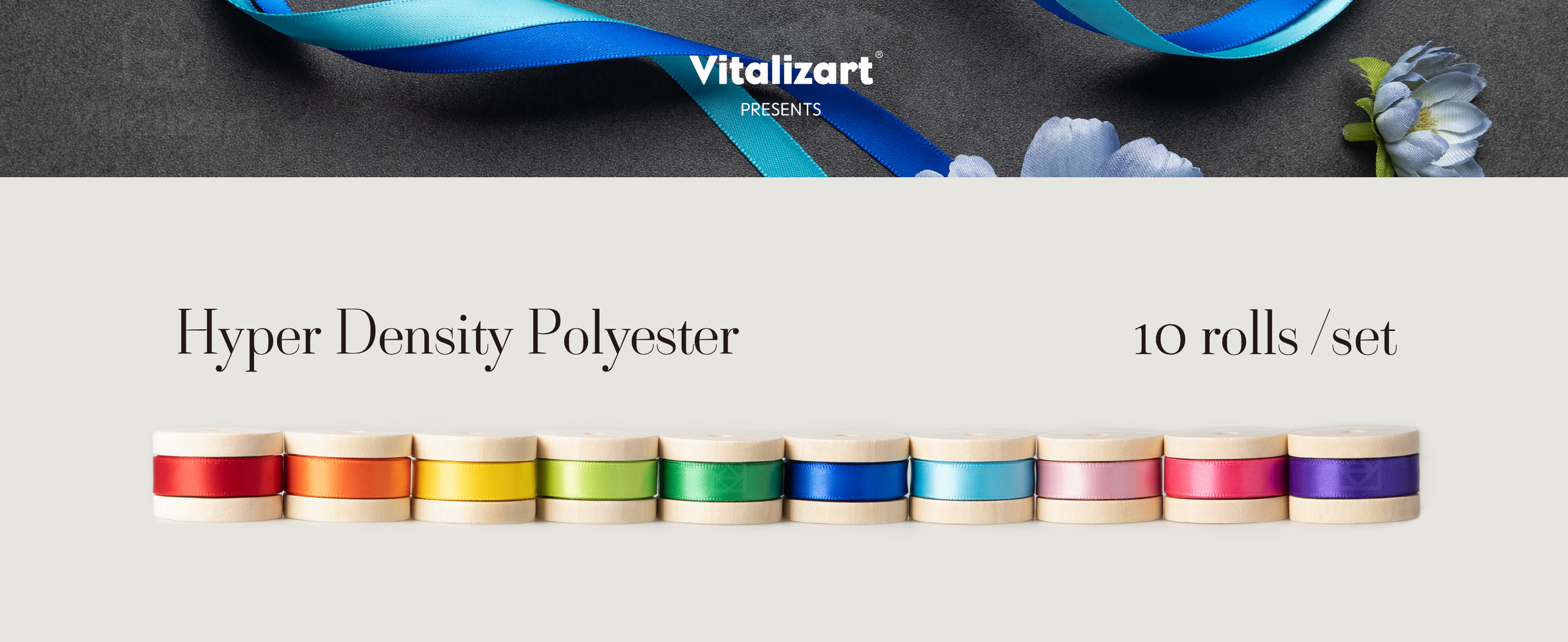 Ten rolls of narrow rainbow satin ribbon wound on pale wooden spools in a single row.