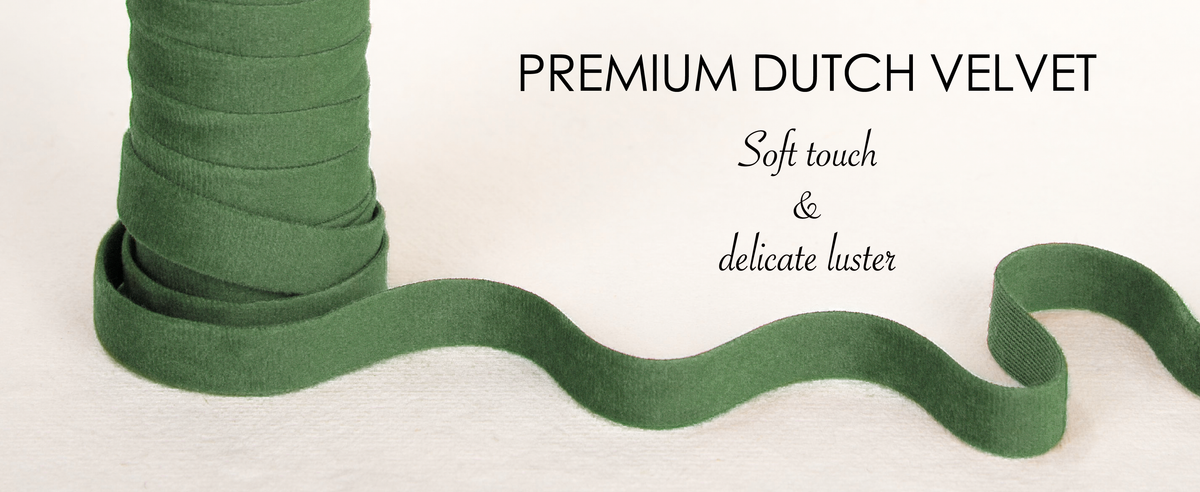 Layered green velvet ribbon swatches show a soft, dense pile and subtle directional luster.
