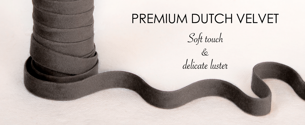 Close-up of layered gray velvet ribbon showing its soft pile and subtle luster.