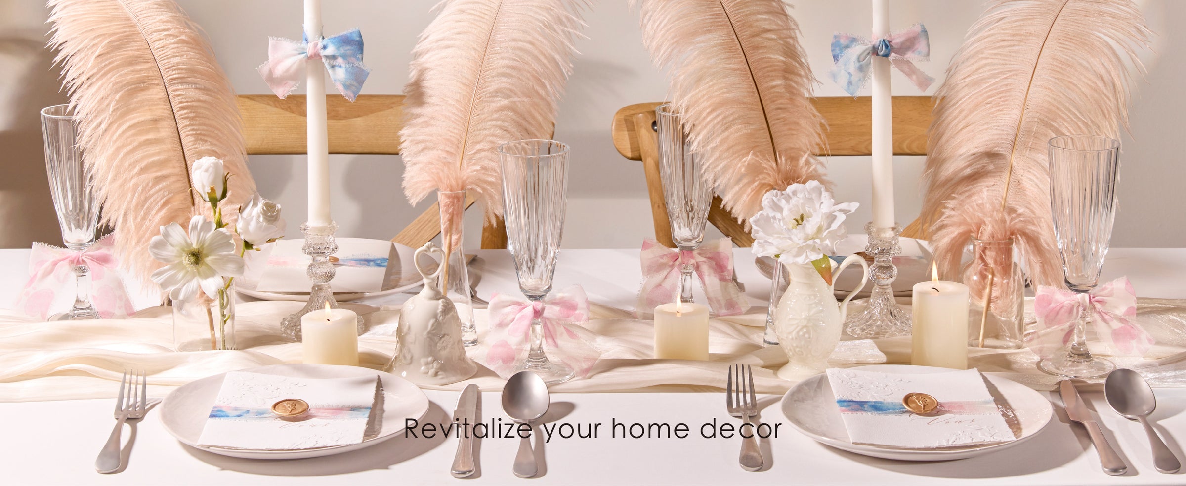 Pastel printed frayed ribbon bows accent candles, glasses, and place settings on a blush dining table