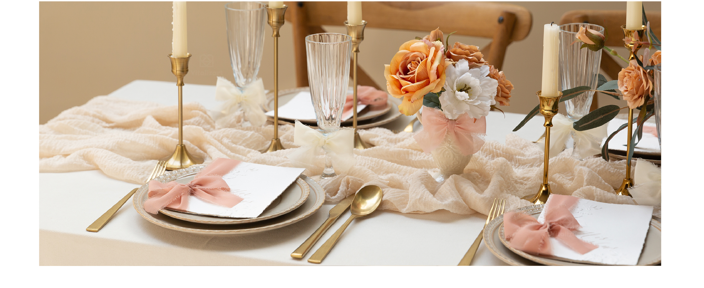 Mixed-color chiffon ribbon bows decorate glassware, cards, and flowers on an elegant table