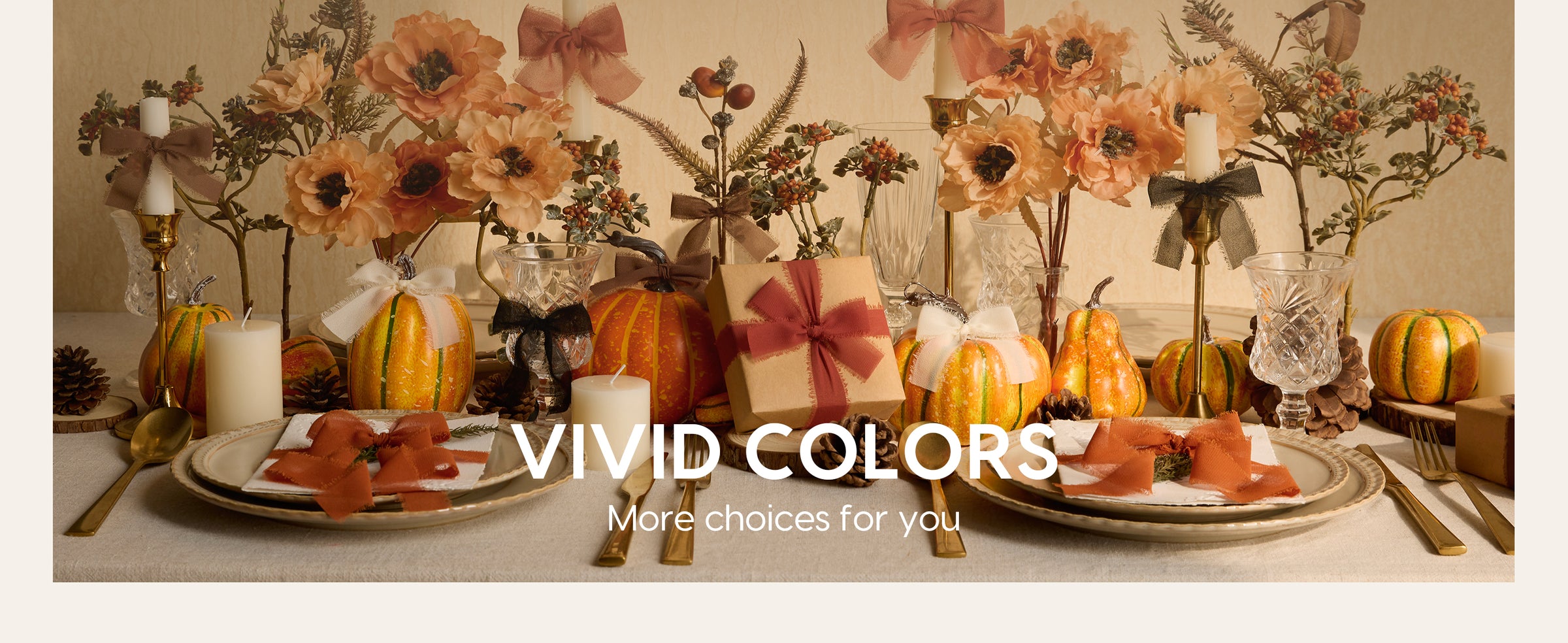 Autumn table setting decorated with terracotta and cream chiffon bows, pumpkins, flowers, and candles.