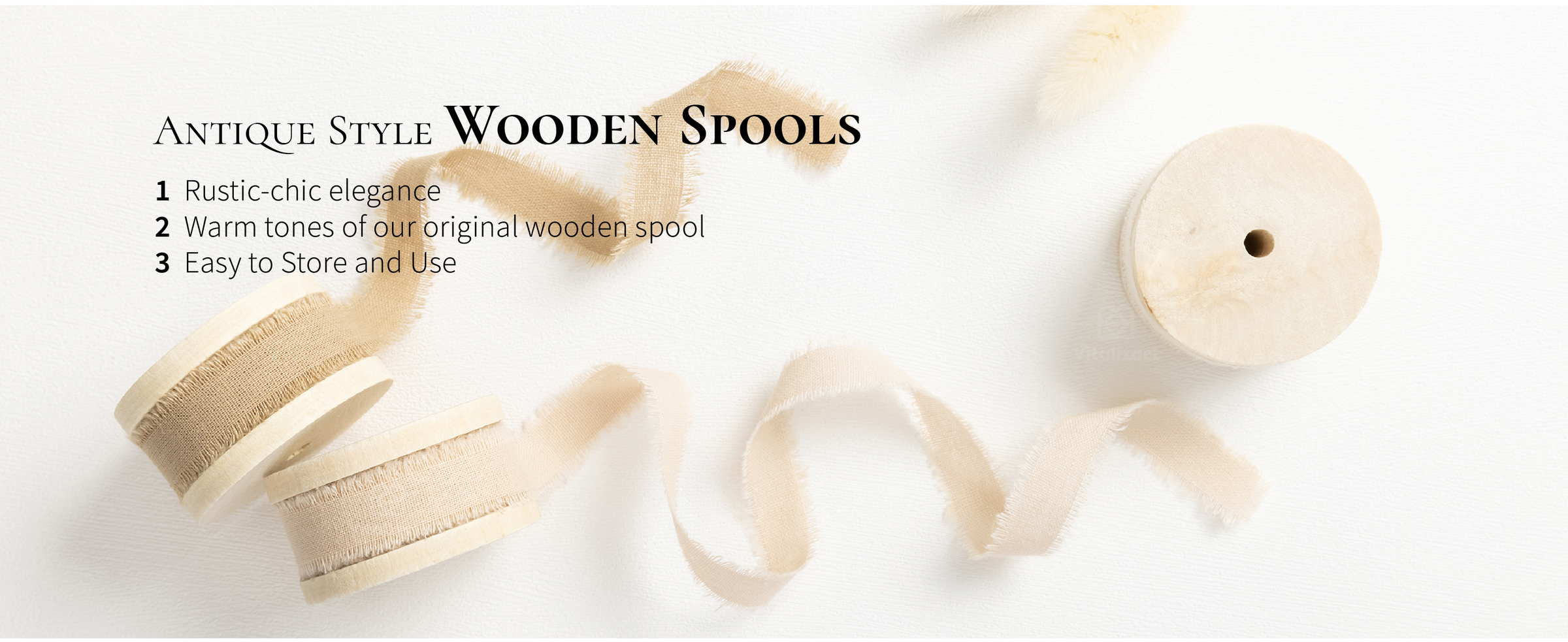Ivory, beige, and tan frayed cotton ribbons unwind from three antique-style wooden spools