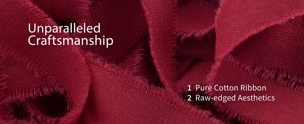 Close-up of deep red cotton ribbon showing its woven texture and raw fringed edges