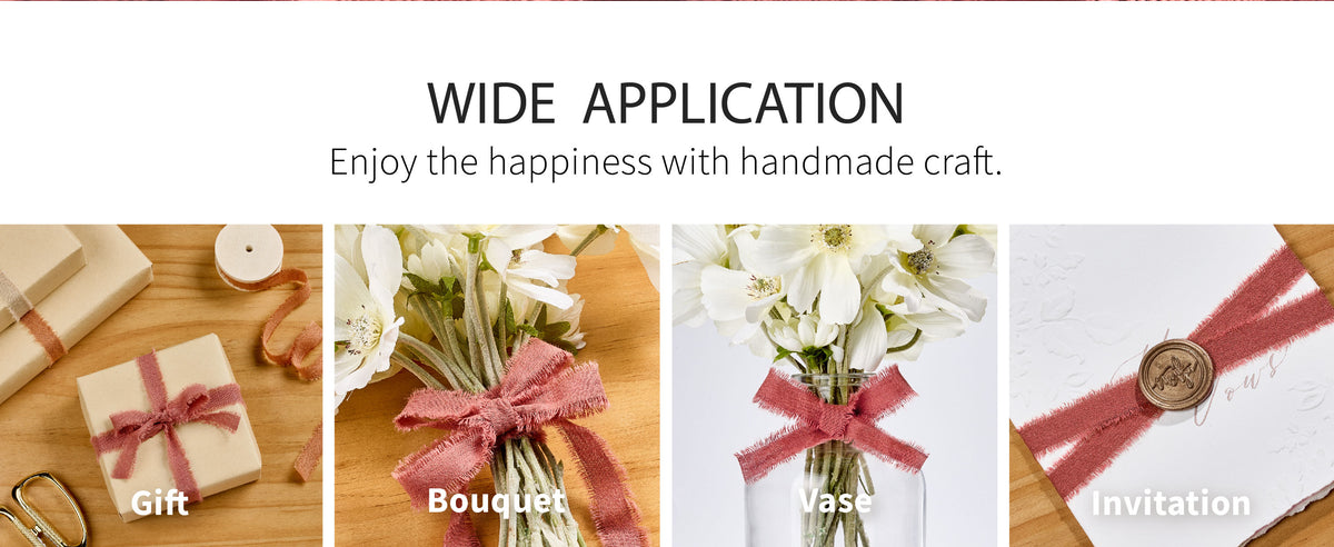 Terracotta fringed cotton ribbon tied around a cream gift box and a bouquet of white flowers.