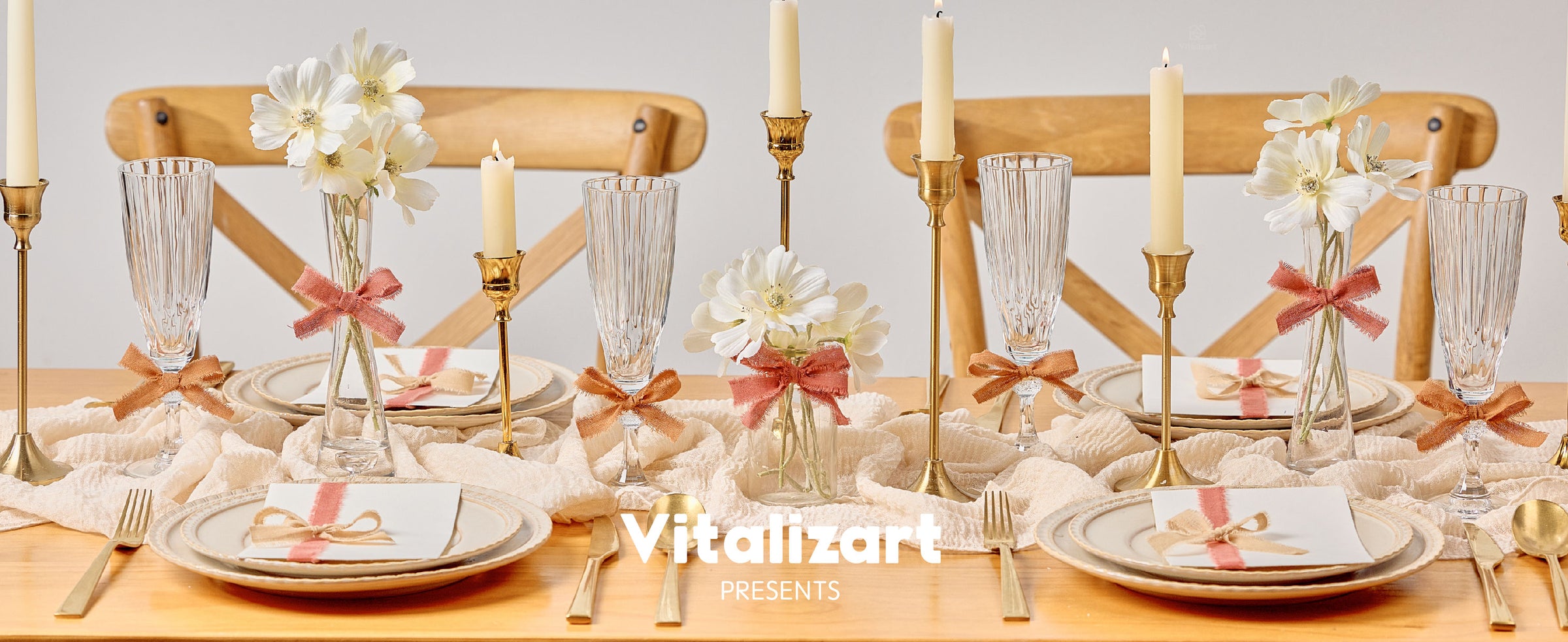 Terracotta fringed cotton ribbon decorates vases, glasses, and place cards on an elegant dining table.