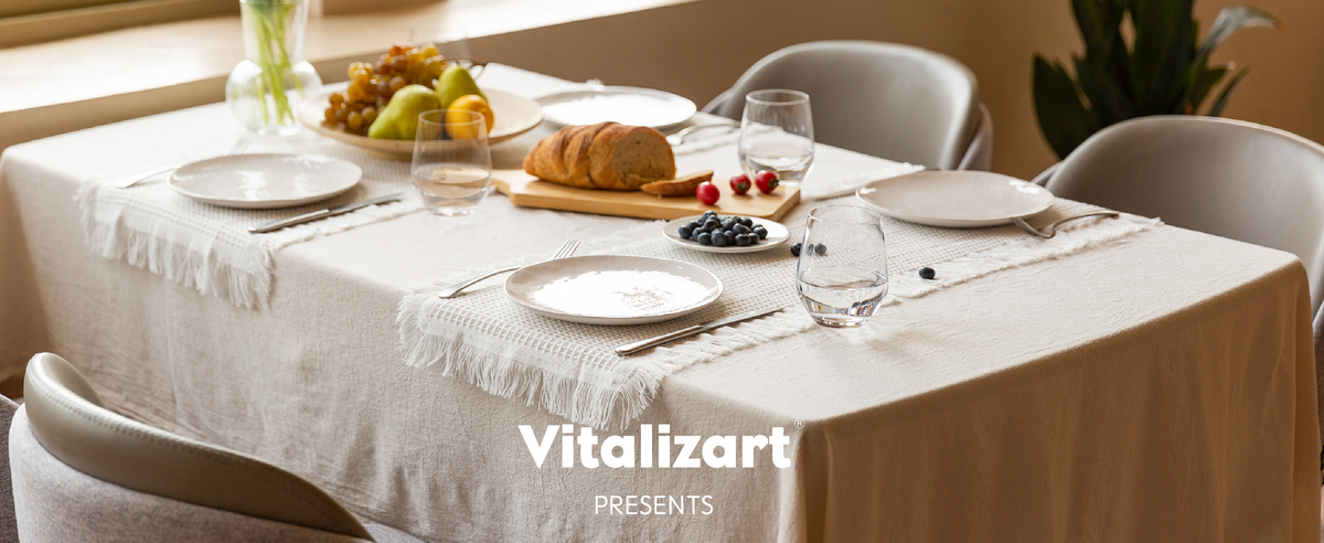 Cream, white, and dusty green waffle-weave table runners with fringe, shown folded and hanging