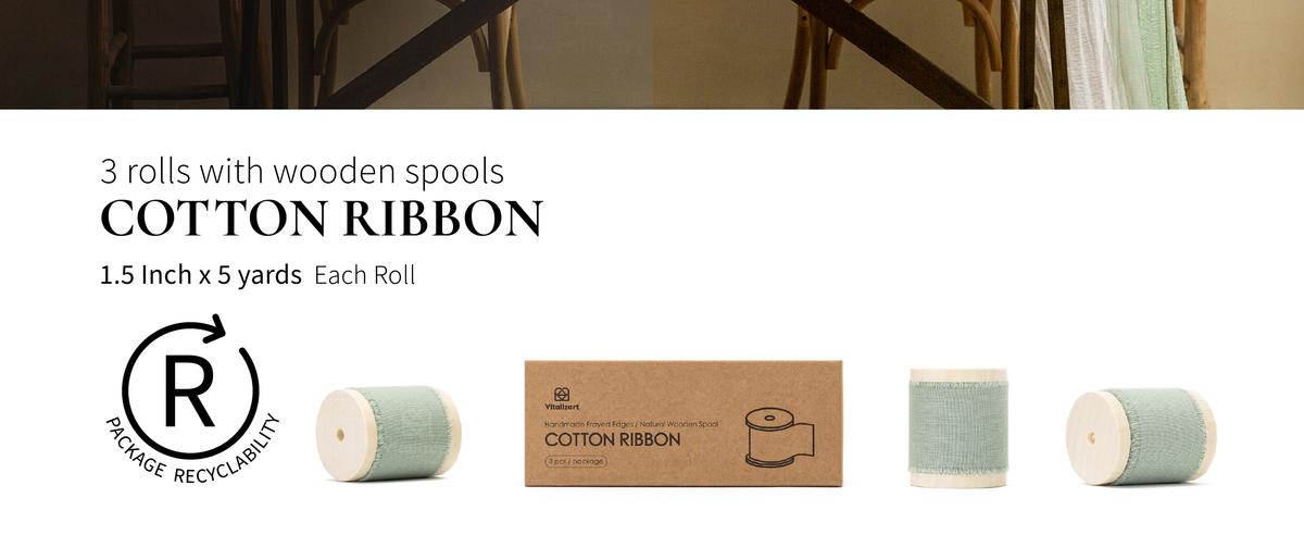 Three dusty green fringed cotton ribbon rolls on wooden spools beside their cardboard box.