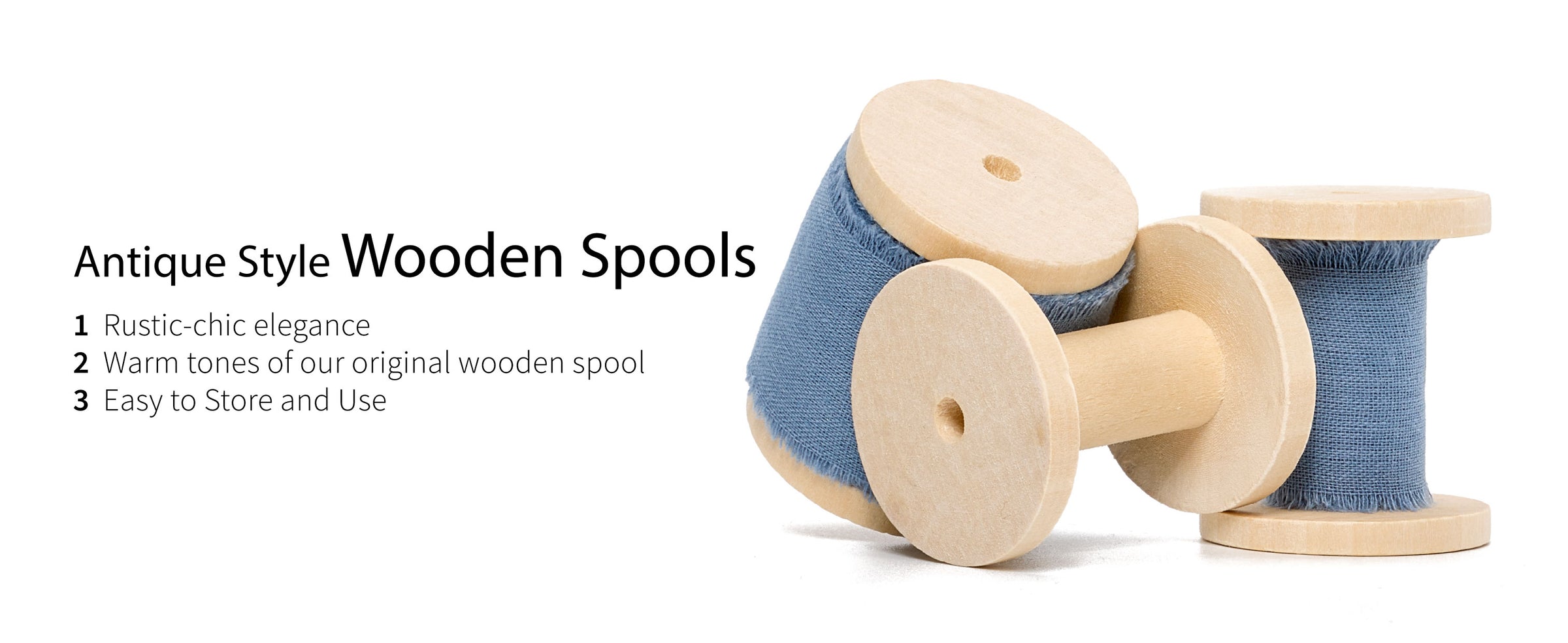 Dusty blue frayed cotton ribbon on pale wooden spools, with an empty spool displayed in front.