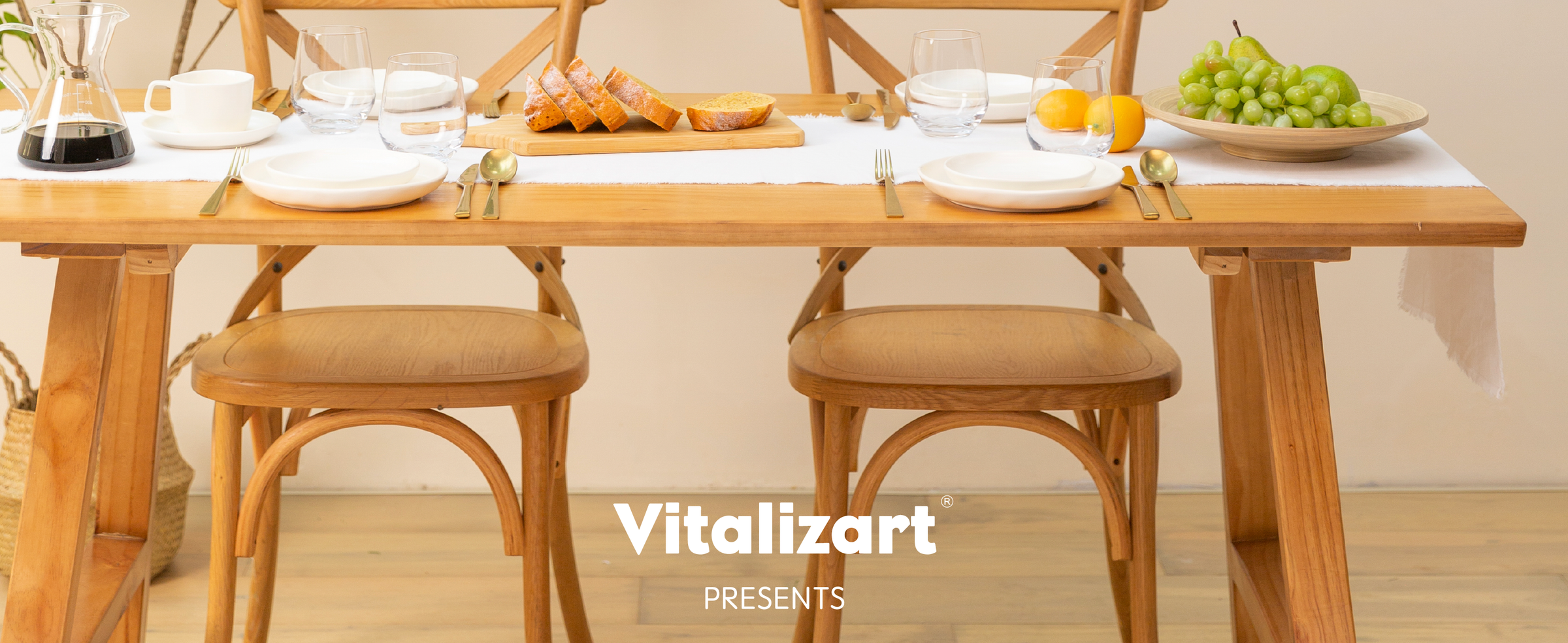 Simply white cotton-linen table runner styled across a bright wood table with place settings
