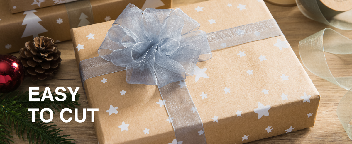 Light blue sheer organza ribbon tied in a full bow around a kraft-paper Christmas gift