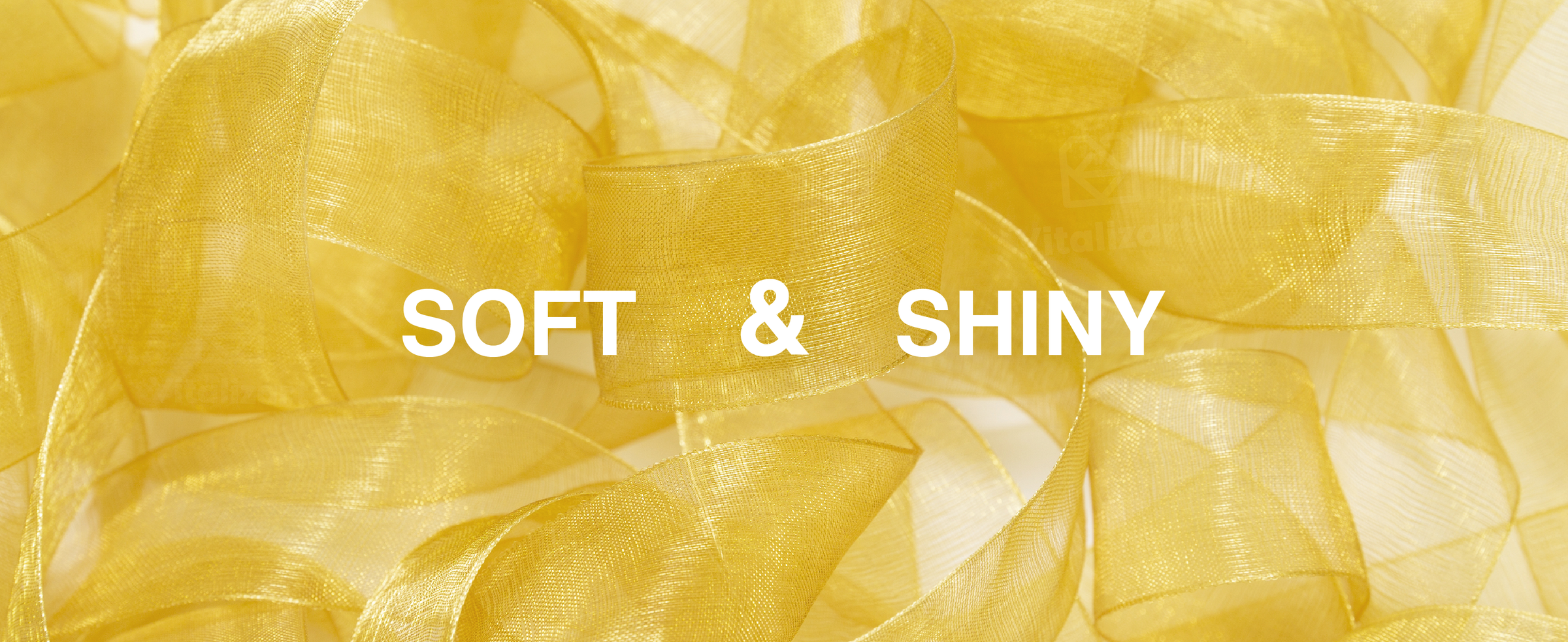 Close-up of gold sheer organza ribbon showing its soft, translucent weave and reflective shine