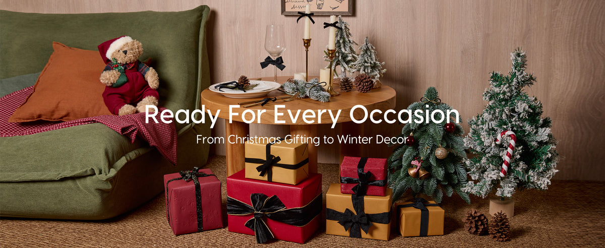 Red and gold Christmas gifts wrapped with assorted black velvet ribbons and bows in a festive living room