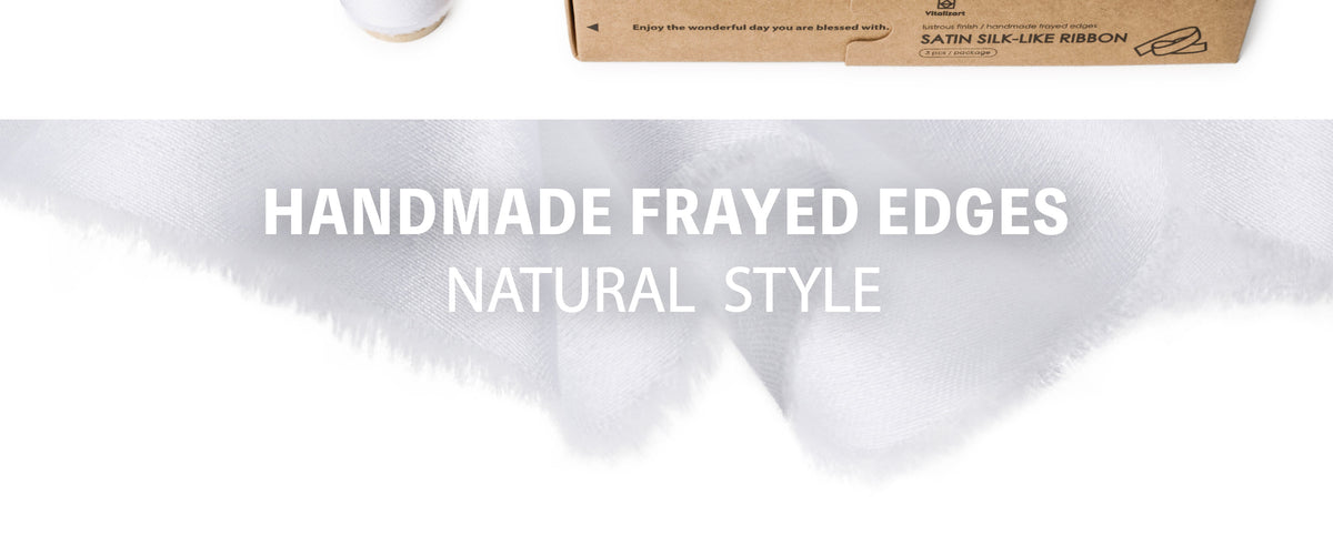 Close-up of glossy white satin-like ribbon with a smooth woven surface and softly frayed edges.