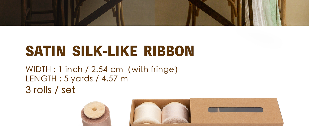 Three cream, champagne, and nude satin-like ribbon rolls on wooden spools, 1 inch by 5 yards each.