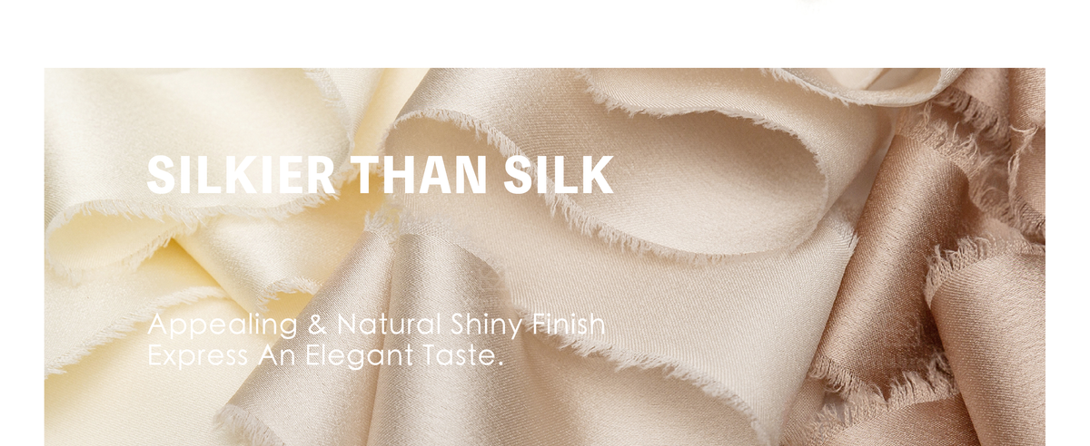 Cream, blush, and nude frayed-edge satin ribbons tied on white gifts and a flower bouquet.