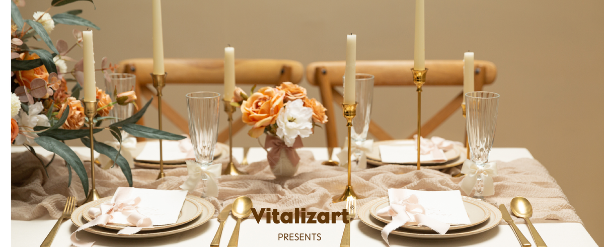 Cream and blush satin ribbons decorate place cards and glasses on a warm formal dining table.