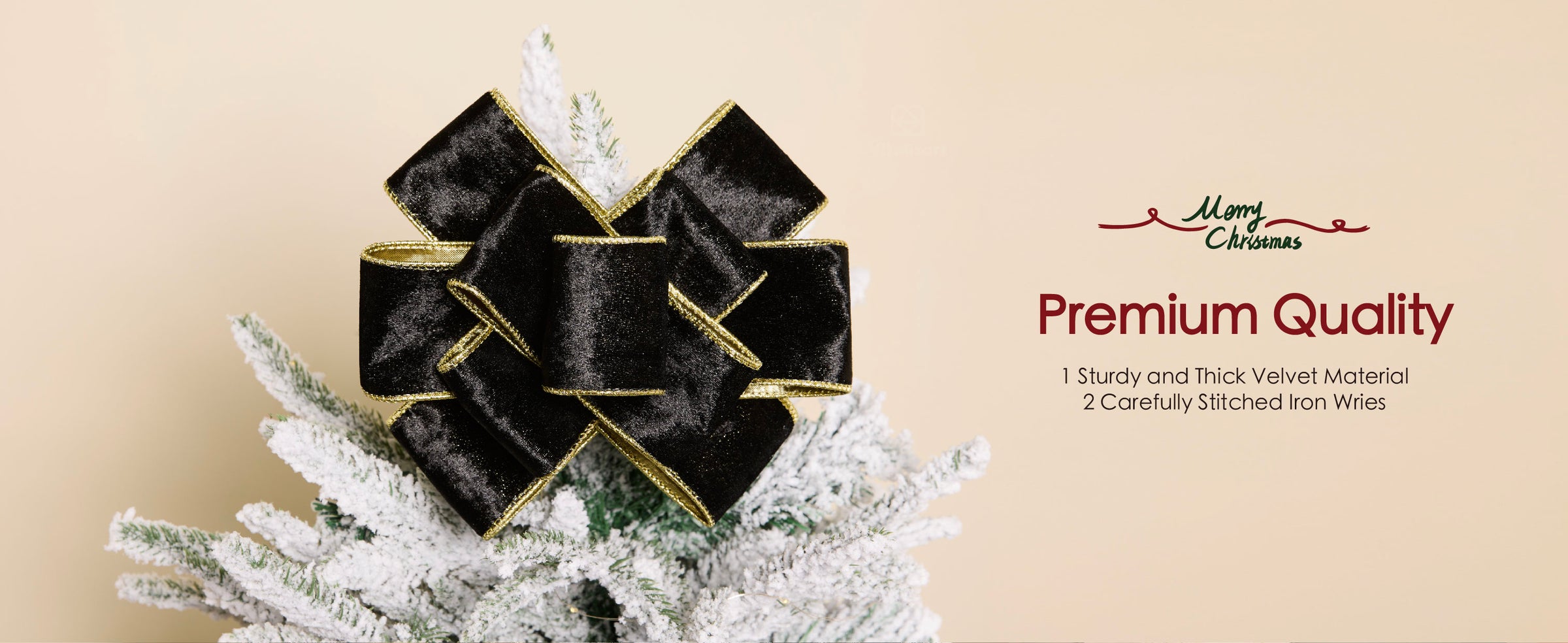 Large black crushed velvet bow with gold wired edges displayed atop a snow-frosted Christmas tree.