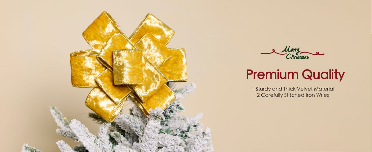 Gold wired crushed velvet ribbon formed into a large bow on a flocked Christmas tree