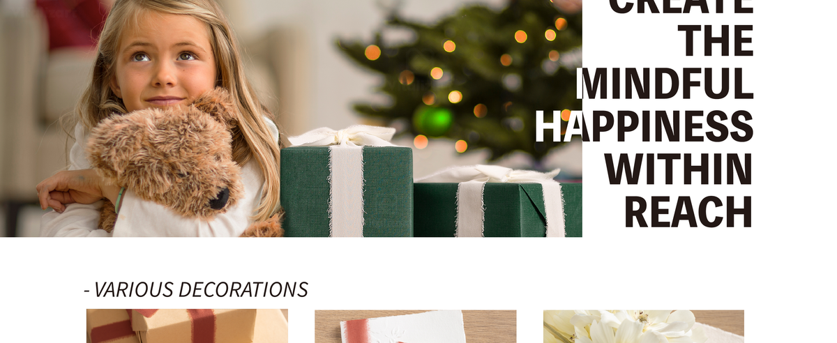 Girl hugs a plush dog beside a green Christmas gift tied with wide, frayed white ribbon.