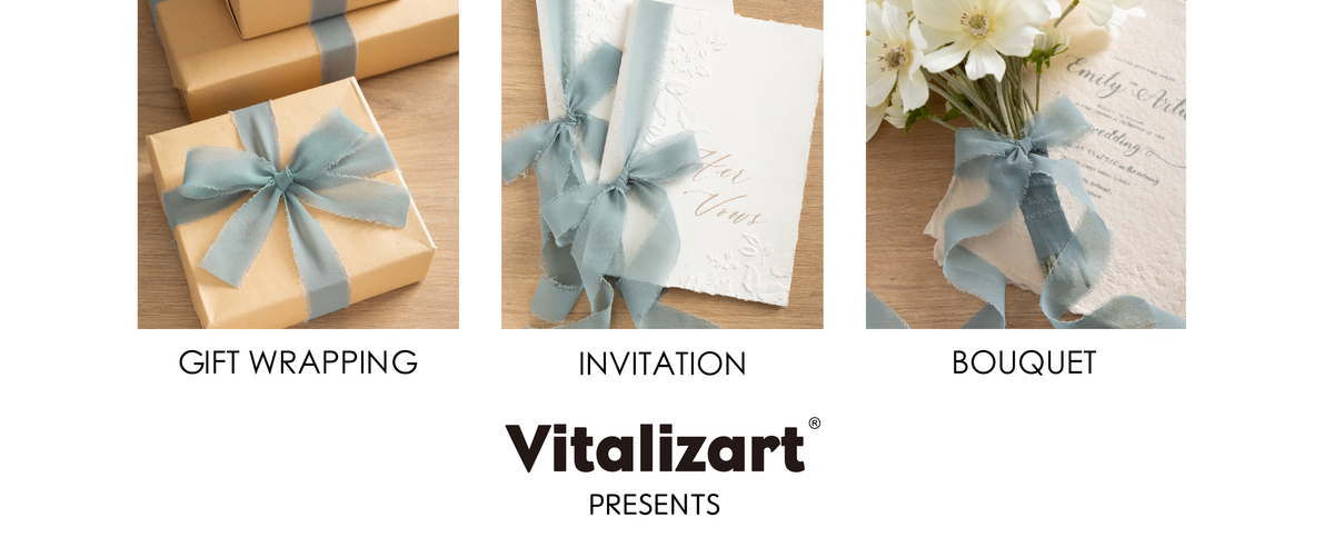 Dusty blue chiffon ribbon decorates kraft gifts, embossed invitations, and a white flower bouquet.