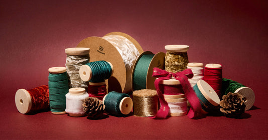 Christmas gifts decorated with festive Vitalizart ribbon