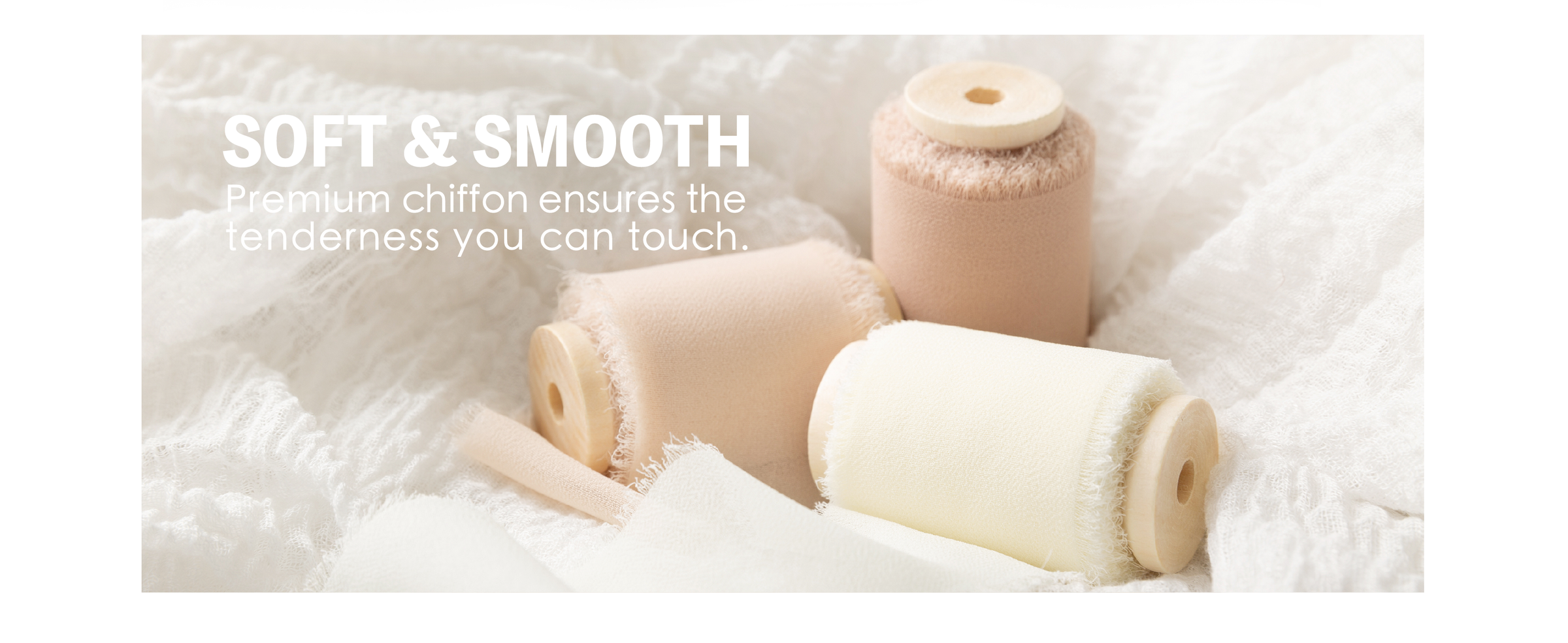 Light nude, cream, and white chiffon ribbon rolls with frayed edges resting on soft white fabric.