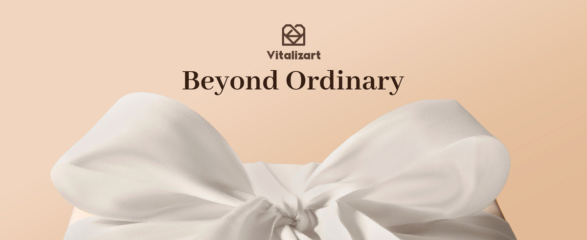 White satin ribbon tied in a large bow with Vitalizart Beyond Ordinary branding