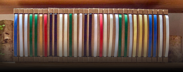 Assorted gift wrapping ribbon boxes with multiple ribbon colors for weddings, birthdays, holidays and retail packaging