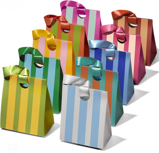 Small striped paper gift bags with ribbon handles in assorted colors