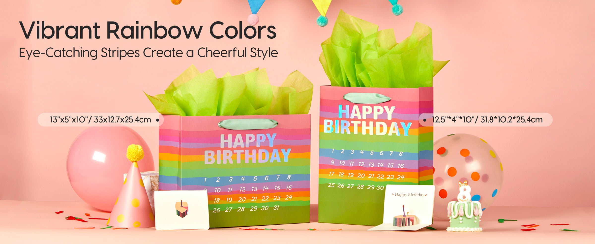 Two rainbow-striped birthday gift bags with green panels, mint handles, tissue paper, and calendars