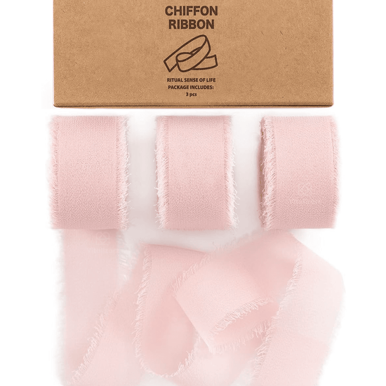 Blush pink chiffon ribbon roll on a white background