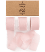 Blush pink chiffon ribbon roll on a white background