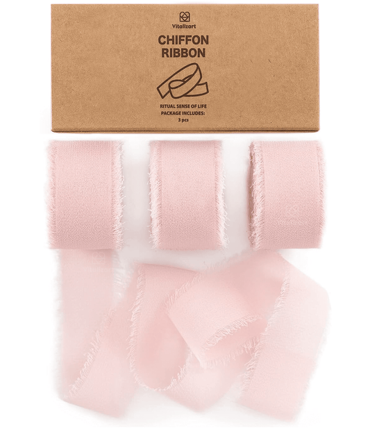 Blush pink chiffon ribbon roll on a white background
