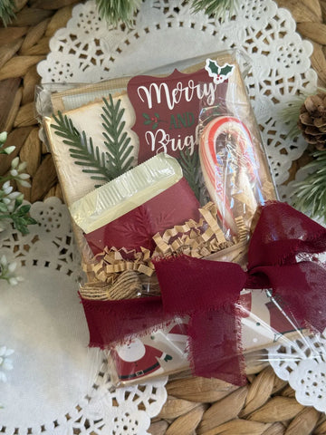 Christmas treat box tied with burgundy frayed ribbon