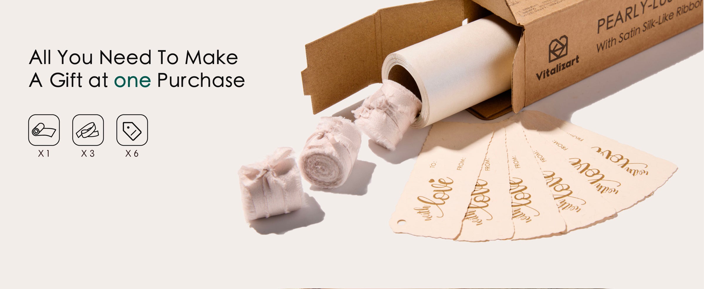 Boxed pearly white wrapping paper set with satin-like ribbons and gift tags, beside FSC and recycling symbols