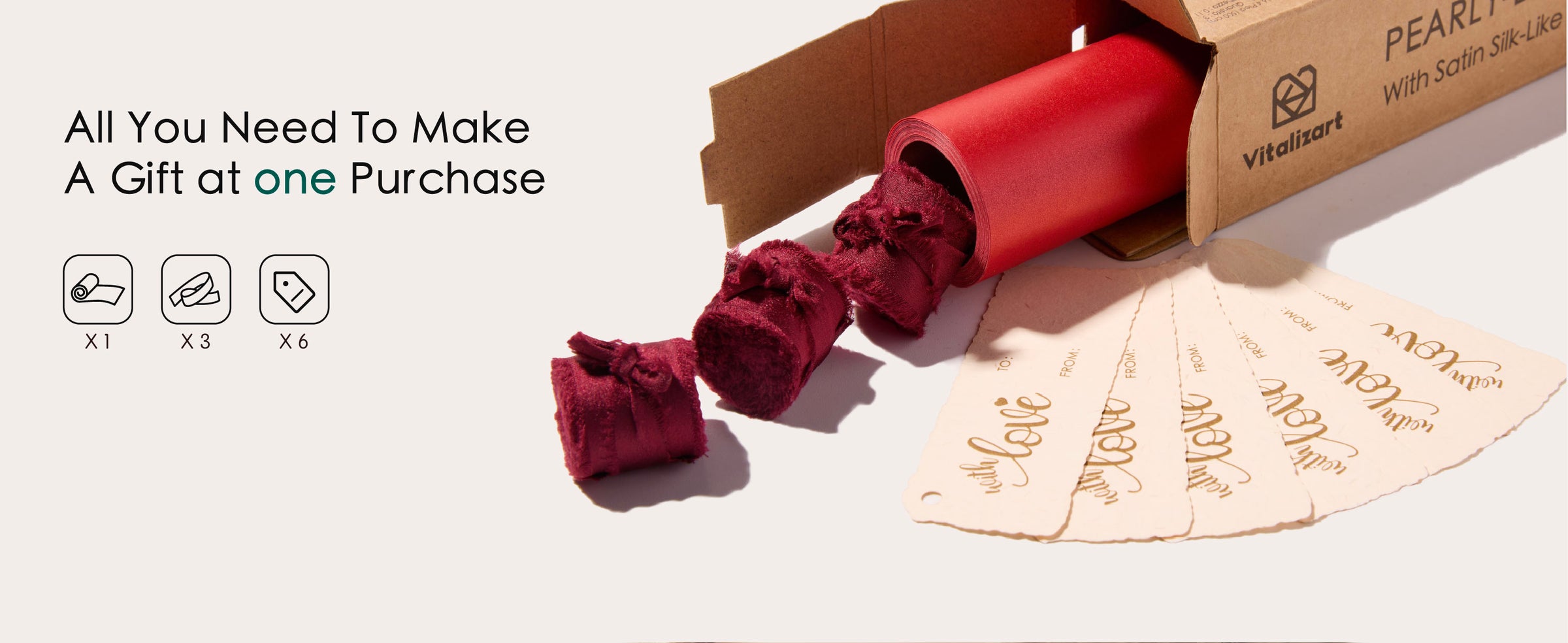 Red wrapping paper set with one roll, three burgundy ribbons, and six cream gift tags